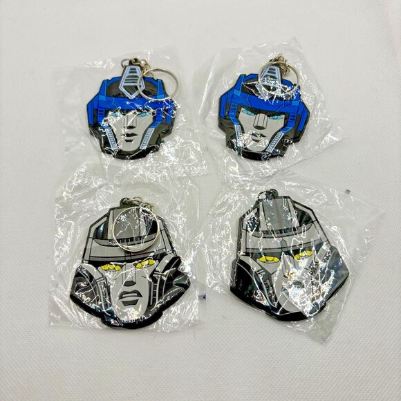 Transformers One Optimus Prime Megatron Key Chains (4) Orion Pax D16 NEW TF - Picture 1 of 3